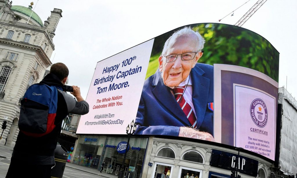 ‘By the time Tom was 57 years old in 1977, the best-off took less than 6% of all income in Britain; three times less than when he was aged 12.’ A birthday message at Piccadilly Circus. Photograph: Toby Melville/Reuters